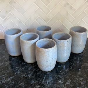 Set of six light blue hand thrown pottery tumblers